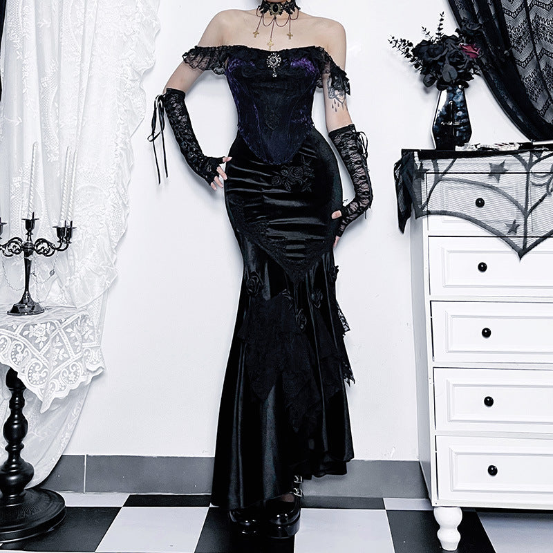 Woman wearing a dark gothic slim-fit dress with a fishtail skirt